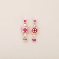 Ruby Radiance: Rose Gold Dangling Earrings with Square Design and Ruby Accents - Shining Silver.in