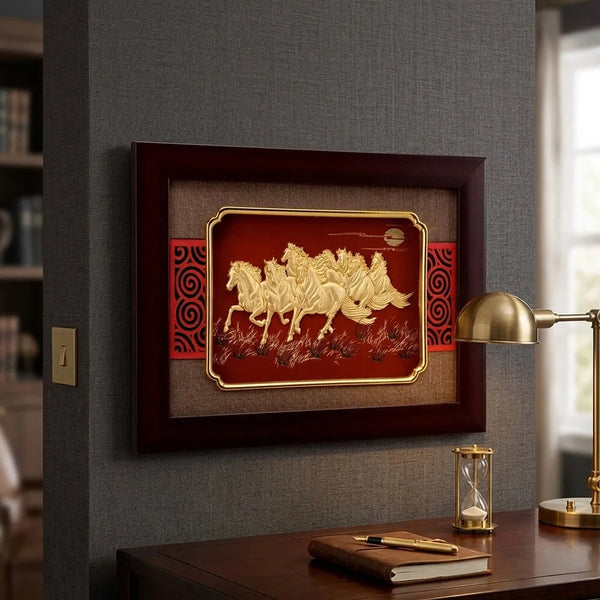 Decorative wall art with horses in a wooden frame on a gray wall above a desk.
