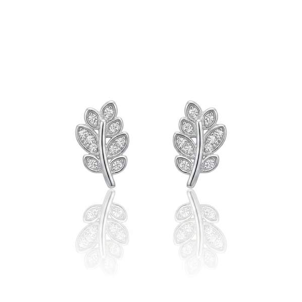 Silver leaf-shaped earrings with clear stones on a white background