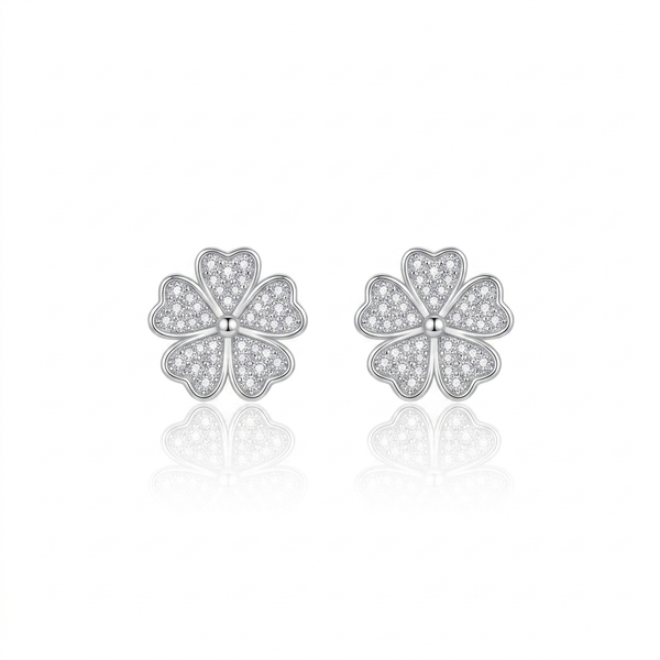 Pair of silver flower-shaped earrings on a white background