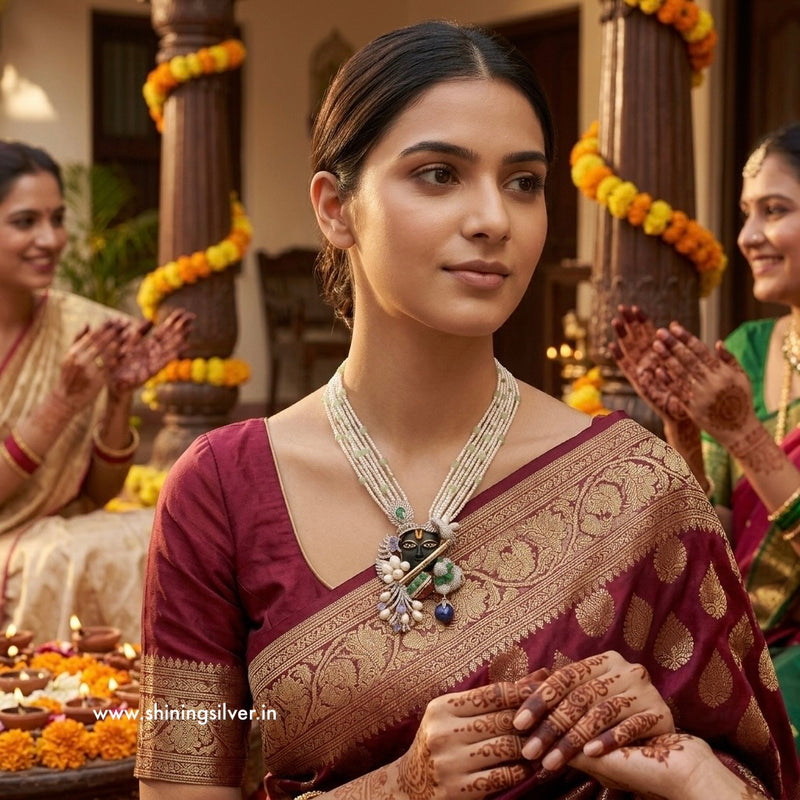 Woman in traditional attire with shrinathji
Neckpiece jewelry, surrounded by festive decorations