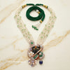 Rosegold plated Silver shrinath ji necklace with green and white beads on a marble surface