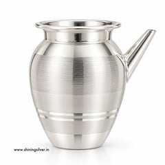 A polished silver-toned metal pitcher with a flared rim, a short angled spout, and horizontal brushed bands on the body, shown on a clean white background.