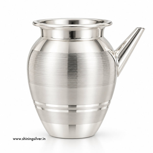 A polished silver-toned metal pitcher with a flared rim, a short angled spout, and horizontal brushed bands on the body, shown on a clean white background.