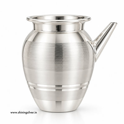 A polished silver-toned metal pitcher with a flared rim, a short angled spout, and horizontal brushed bands on the body, shown on a clean white background.