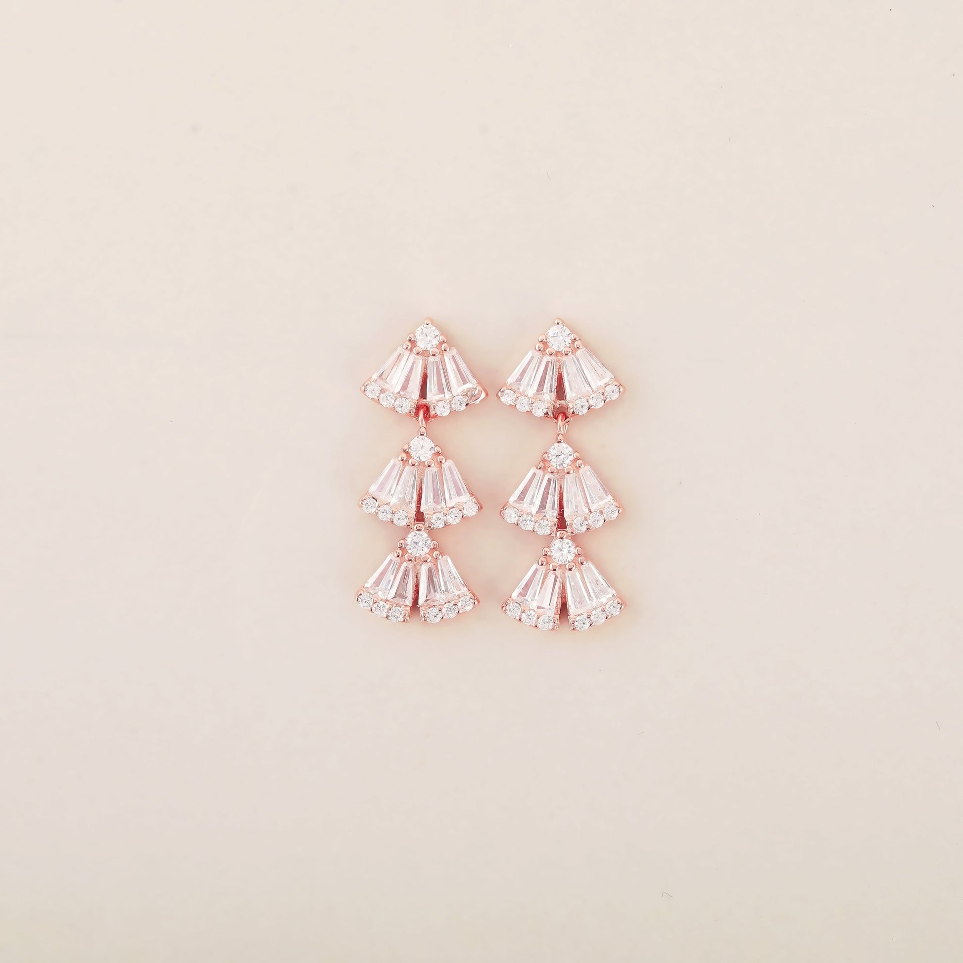 Baguette Brilliance: Rose Gold Earrings with Triangular Sterling Silver Studs Adorned with Baguette CZ Stones - Shining Silver.in