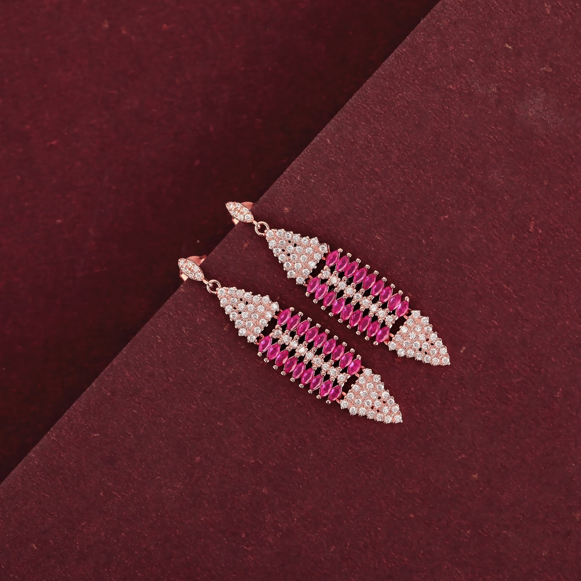 Radiant Ruby Cascade: Rose Gold-Plated Dangling Earrings with Marquis Cut Rubies and CZ Stones - Shining Silver.in